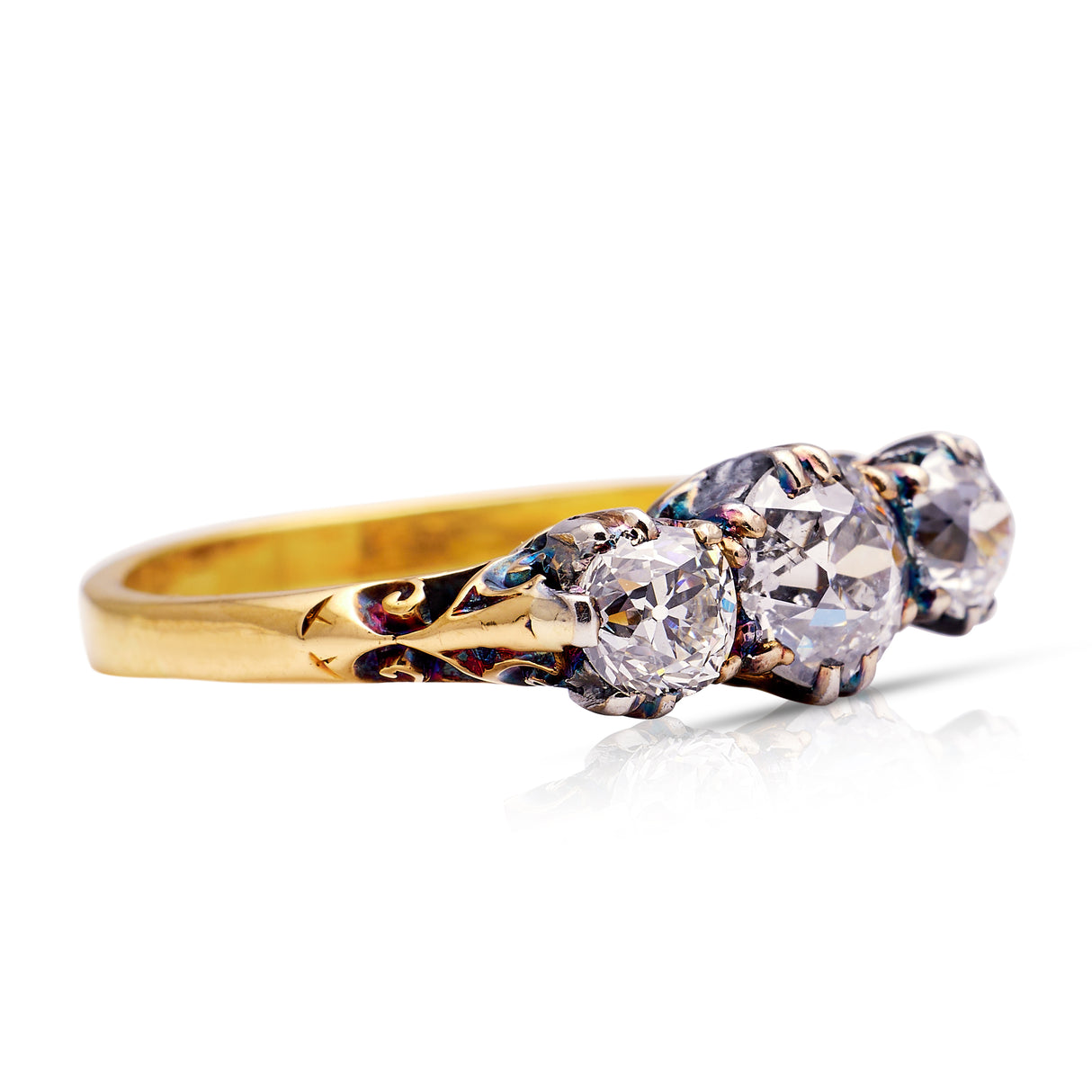 Antique Edwardian three-stone diamond engagement ring, side view.