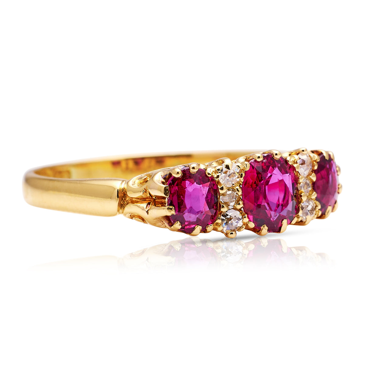 Victorian three-stone ruby and diamond engagement ring, side view.