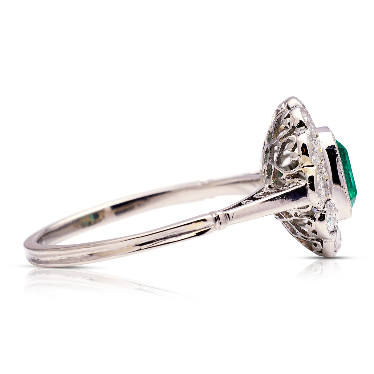 Edwardian emerald and diamond cluster ring, side view.
