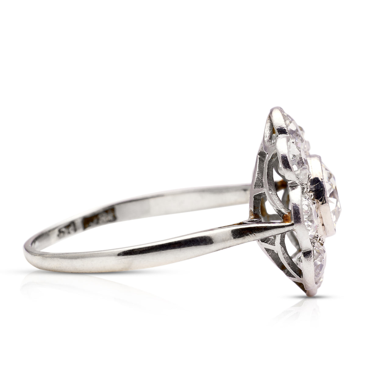 Diamond daisy cluster ring, side view.