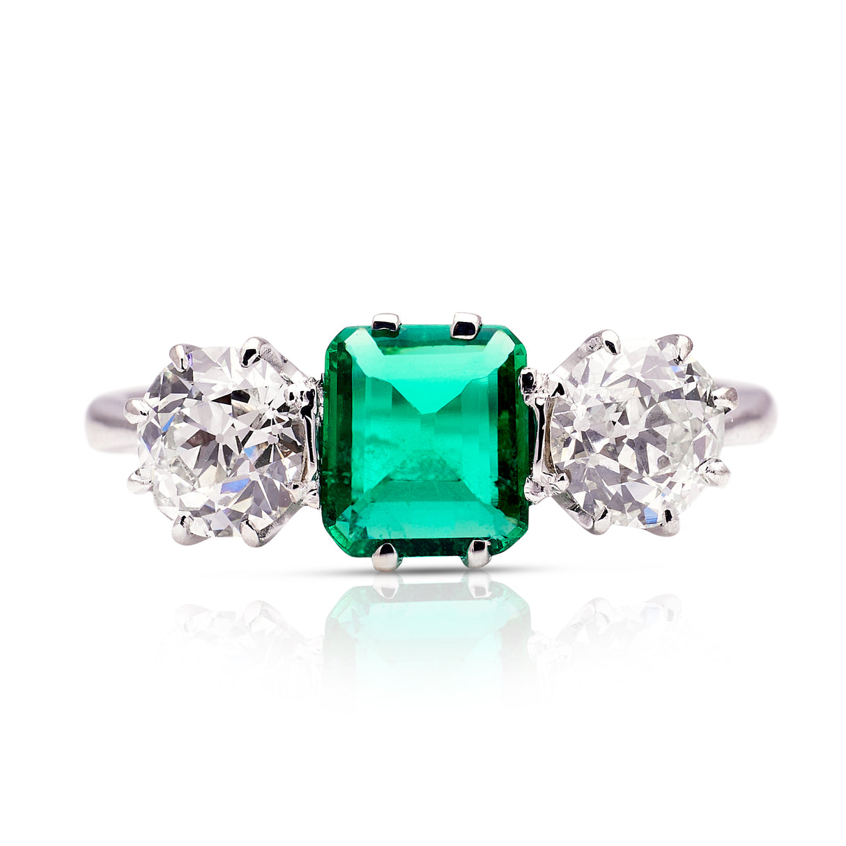 Vintage Art Deco three-stone emerald and diamond engagement ring, front view.