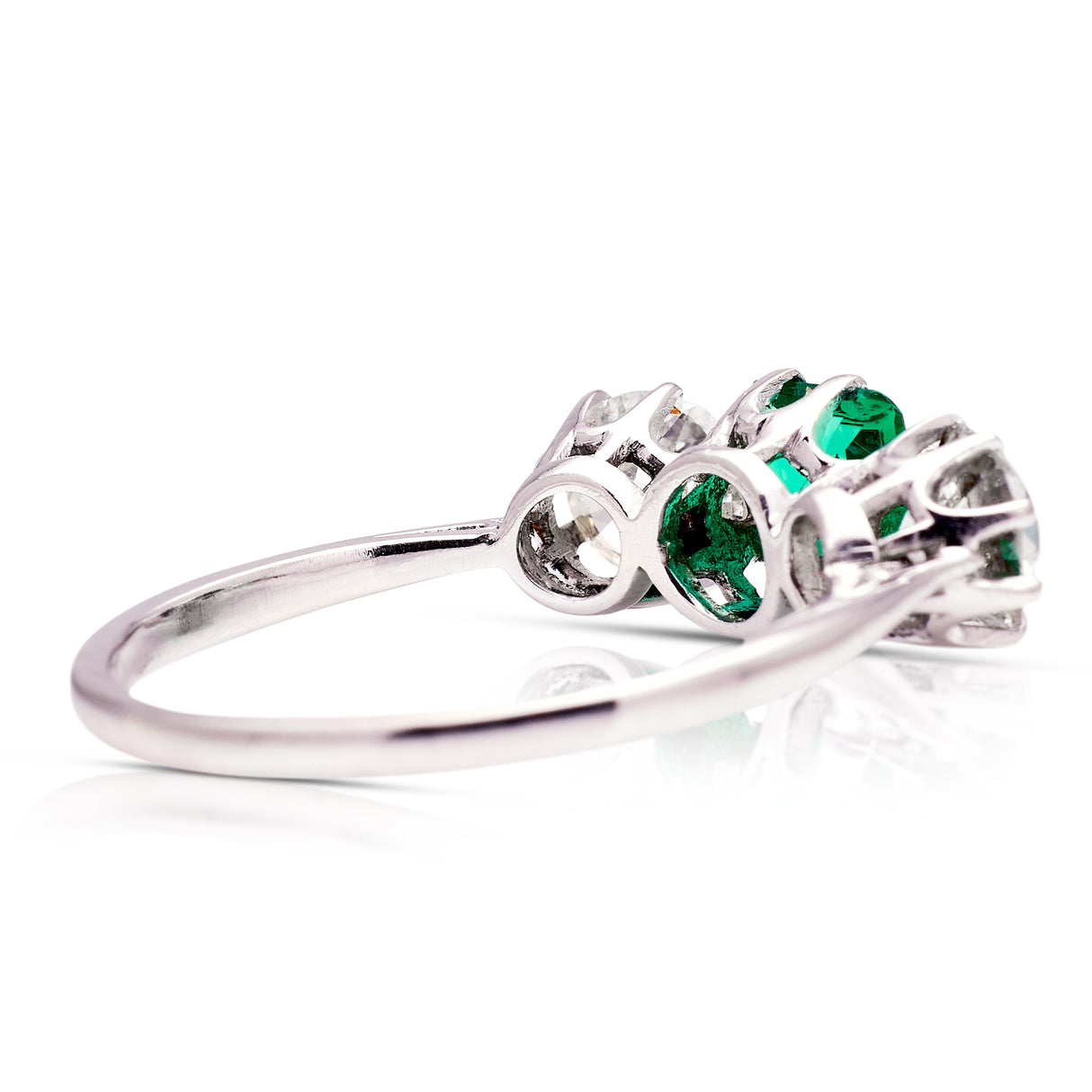Vintage Art Deco three-stone emerald and diamond engagement ring, rear view.