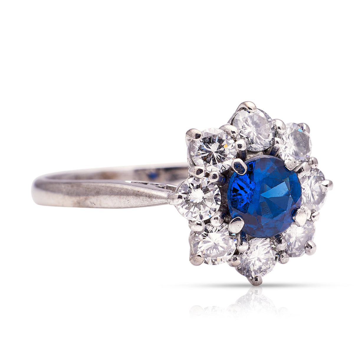 sapphire and diamond cluster engagement ring, side view.