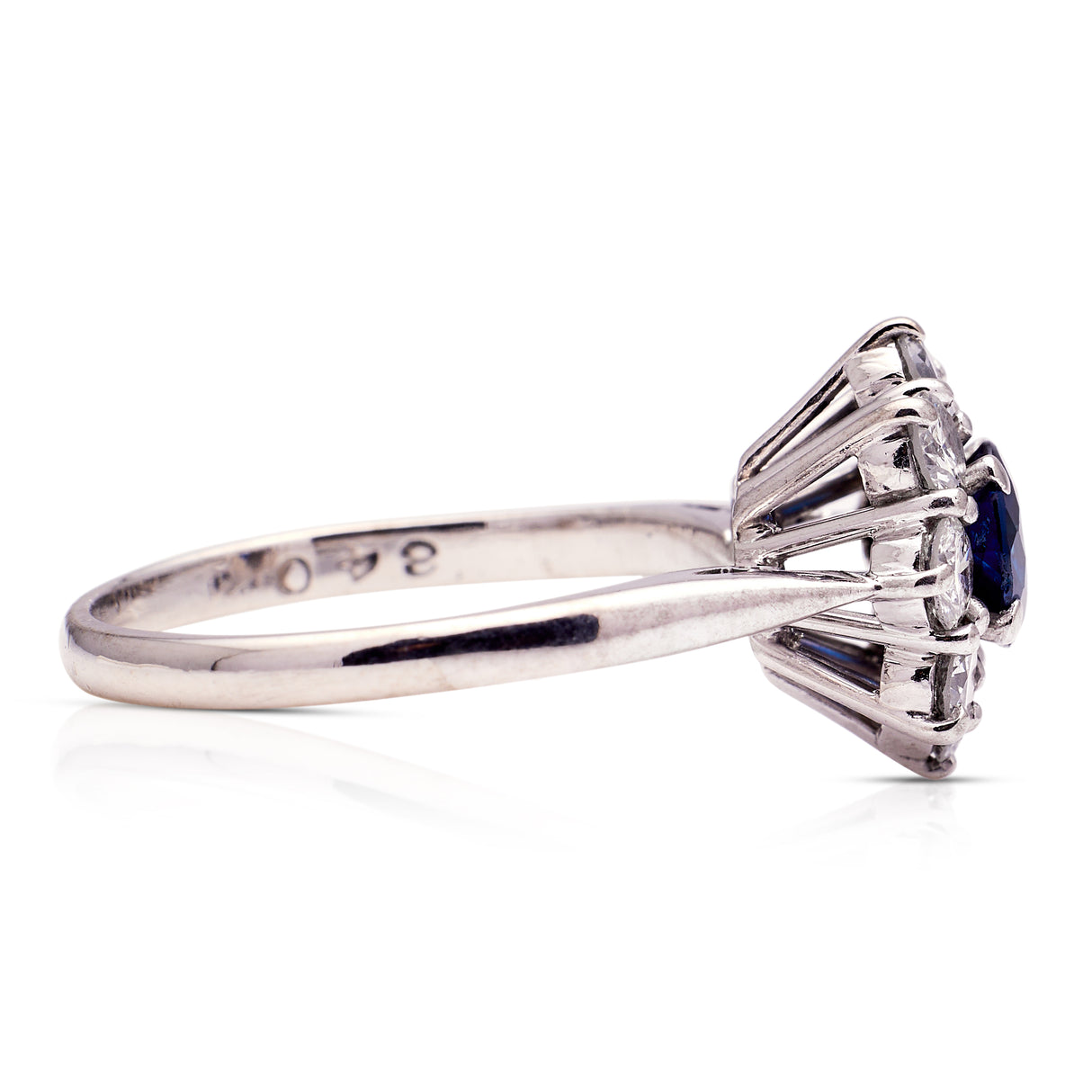 sapphire and diamond cluster engagement ring, side view.