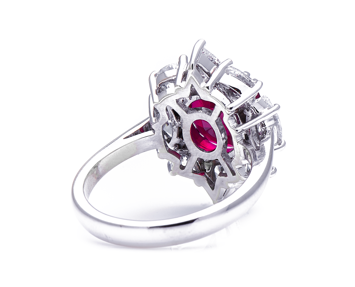 18ct white gold, ‘pigeon’s blood’ 4.27ct ruby and diamond cluster ring