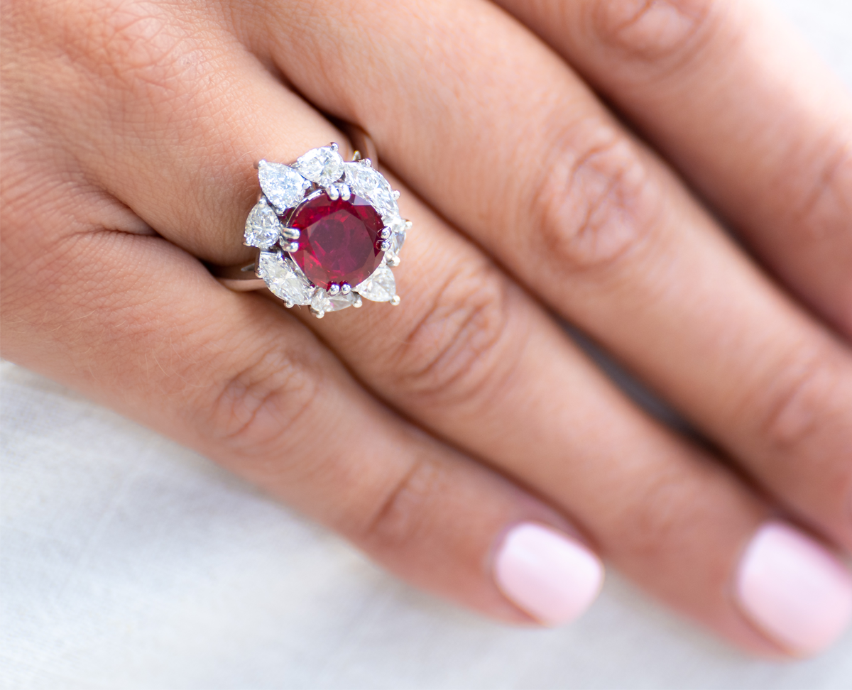 18ct white gold, ‘pigeon’s blood’ 4.27ct ruby and diamond cluster ring