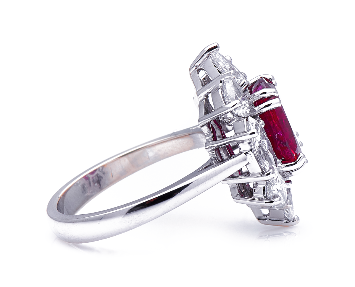 18ct white gold, ‘pigeon’s blood’ 4.27ct ruby and diamond cluster ring