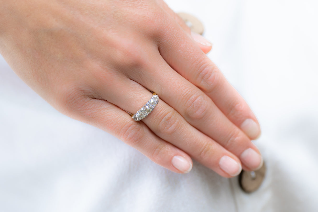 Edwardian, 18ct gold and platinum, old cushion-cut diamond five stone engagement ring