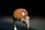 Belle Époque, 18ct gold, cabochon peach moonstone & diamond ring