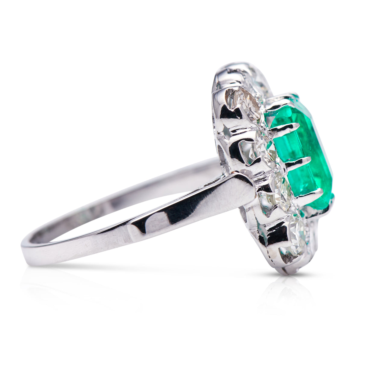 Engagement | 18ct white gold, Colombian emerald and diamond cluster ring