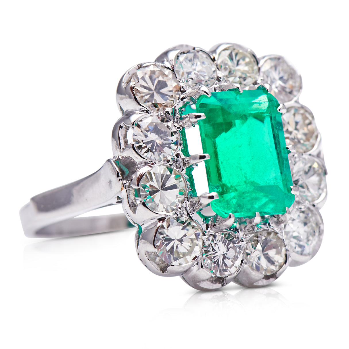 Engagement | 18ct white gold, Colombian emerald and diamond cluster ring