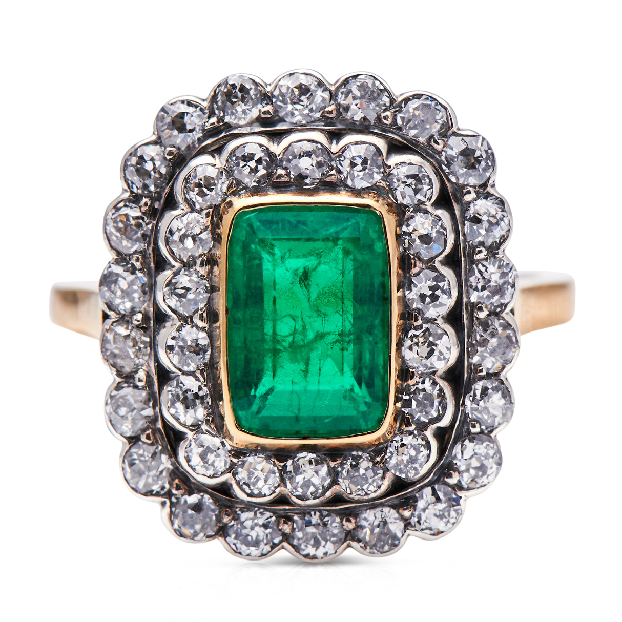 Edwardian, 18ct gold, Colombian emerald and diamond cluster ring