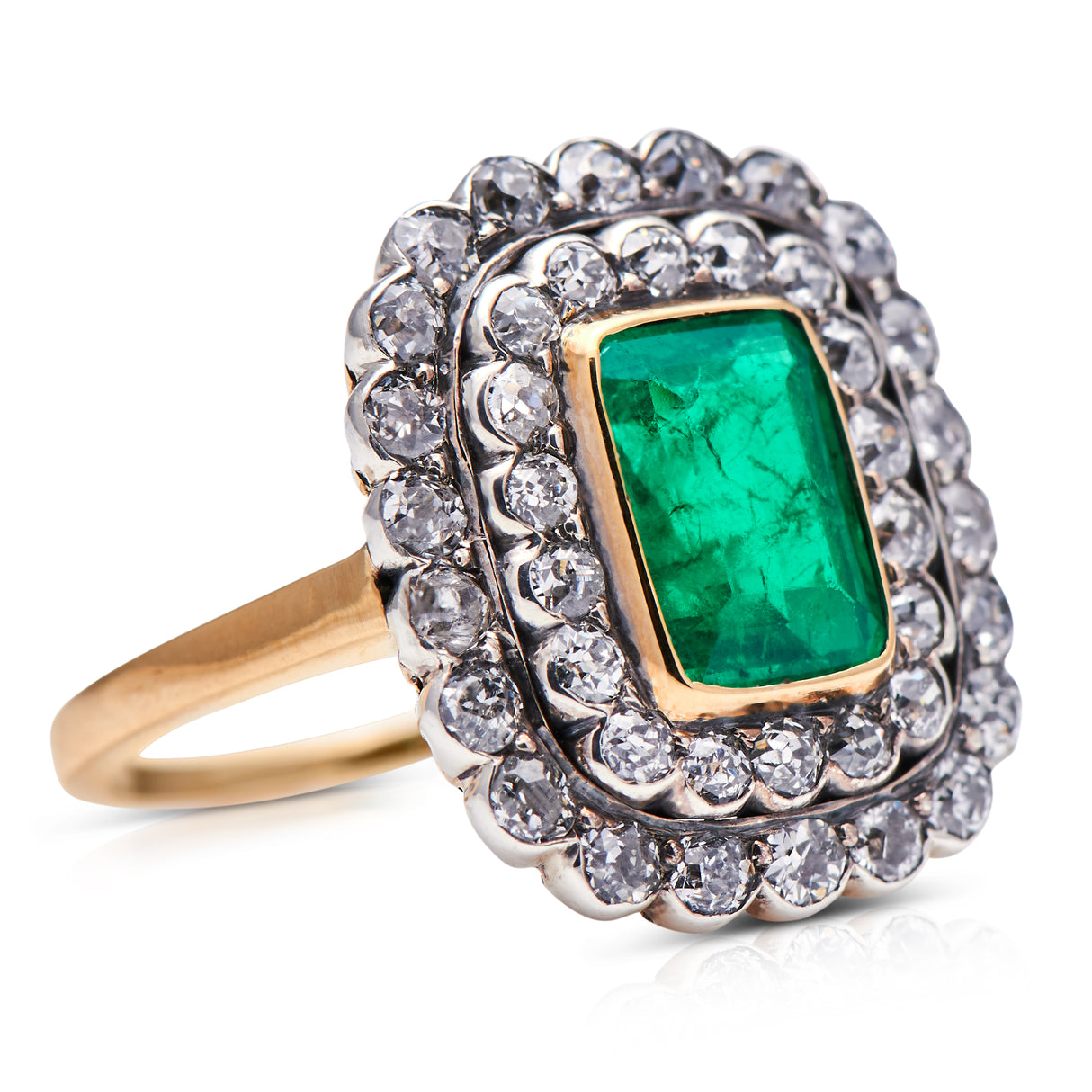 Edwardian, 18ct gold, Colombian emerald and diamond cluster ring