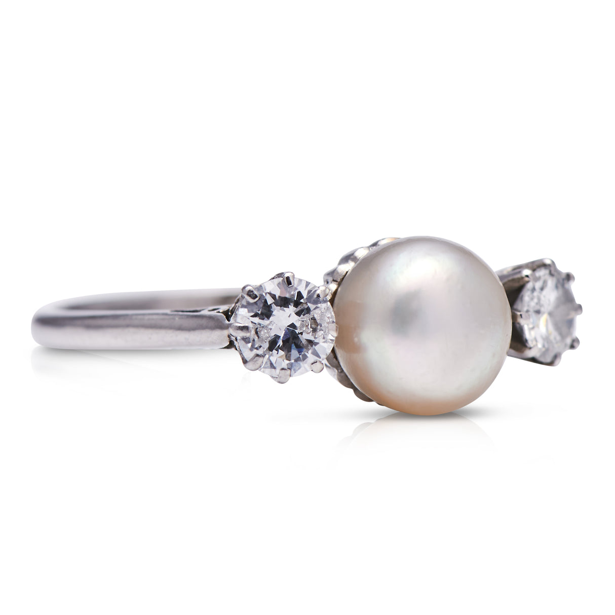 Edwardian, platinum, natural pearl and diamond three stone ring