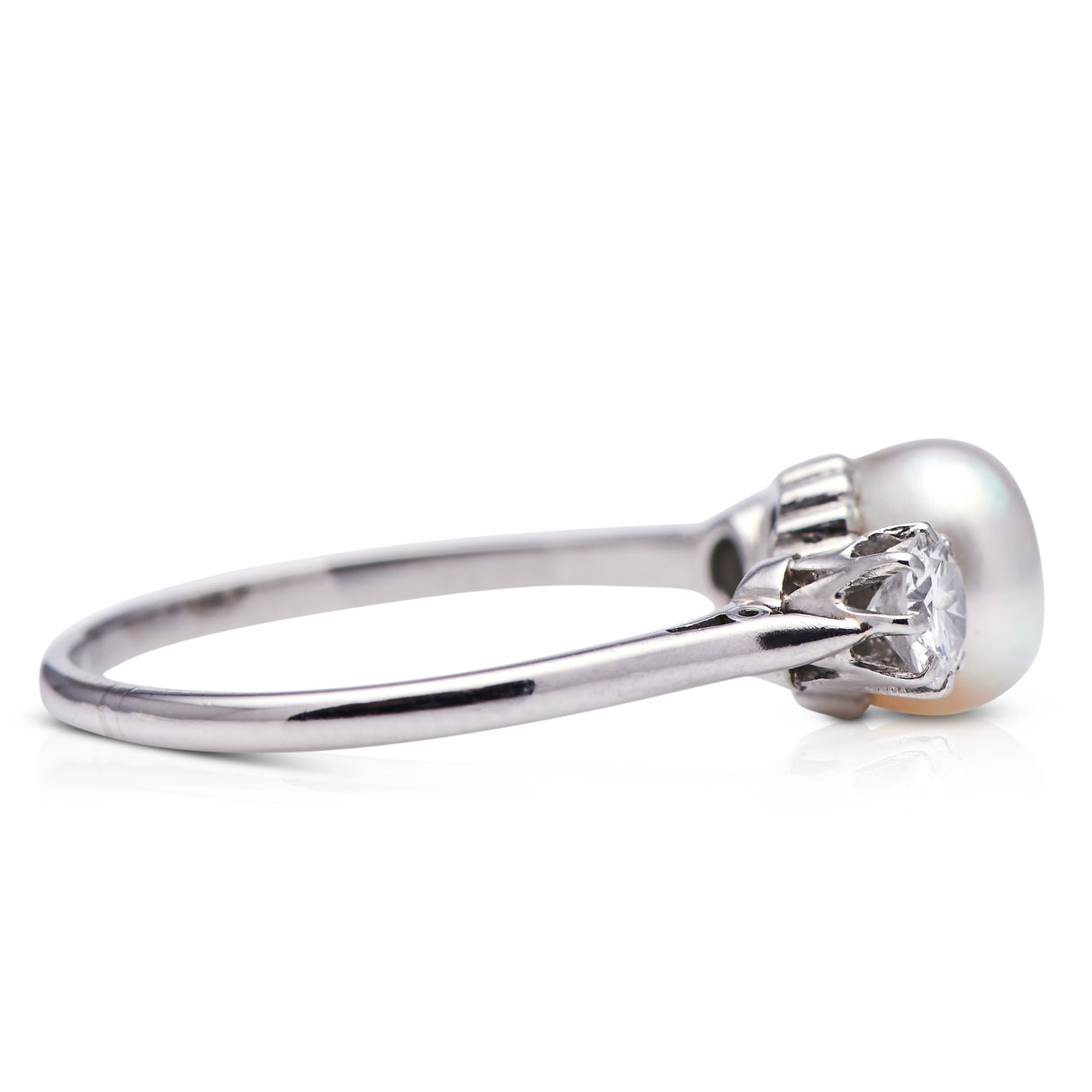 Edwardian, platinum, natural pearl and diamond three stone ring