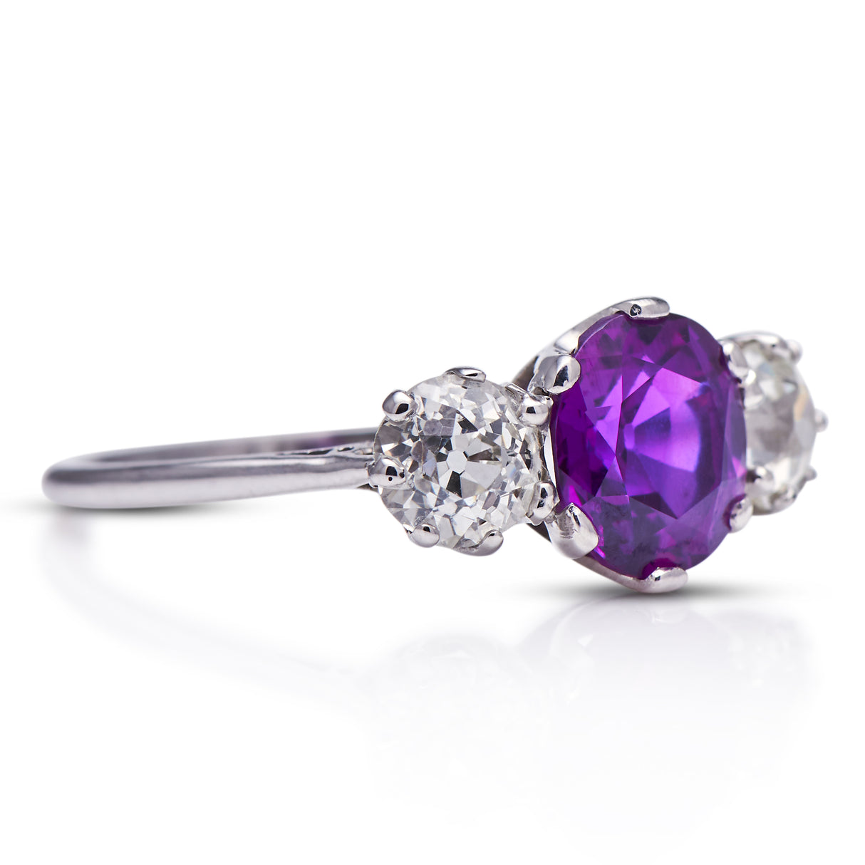 Art Deco, purple sapphire and diamond three-stone engagement ring, platinum