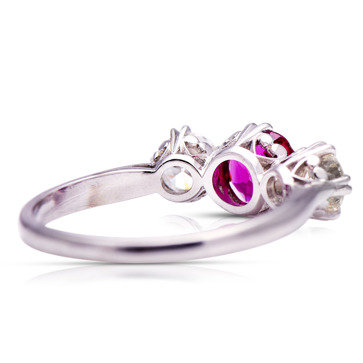 Ruby and diamond three-stone engagement ring, rear view.