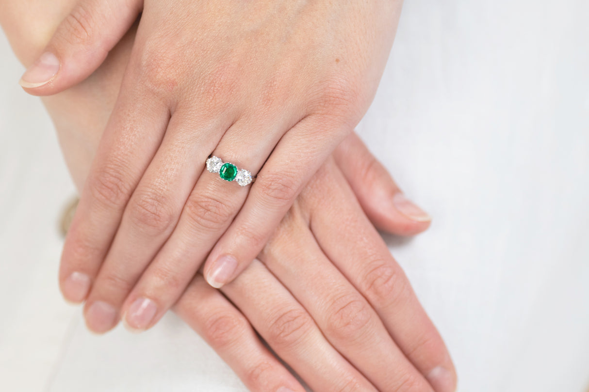 Art Deco, platinum, emerald and diamond three stone ring