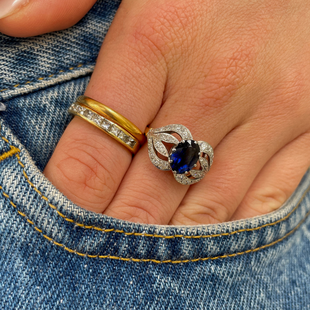 Art Nouveau, sapphire and diamond ring, worn on hand.