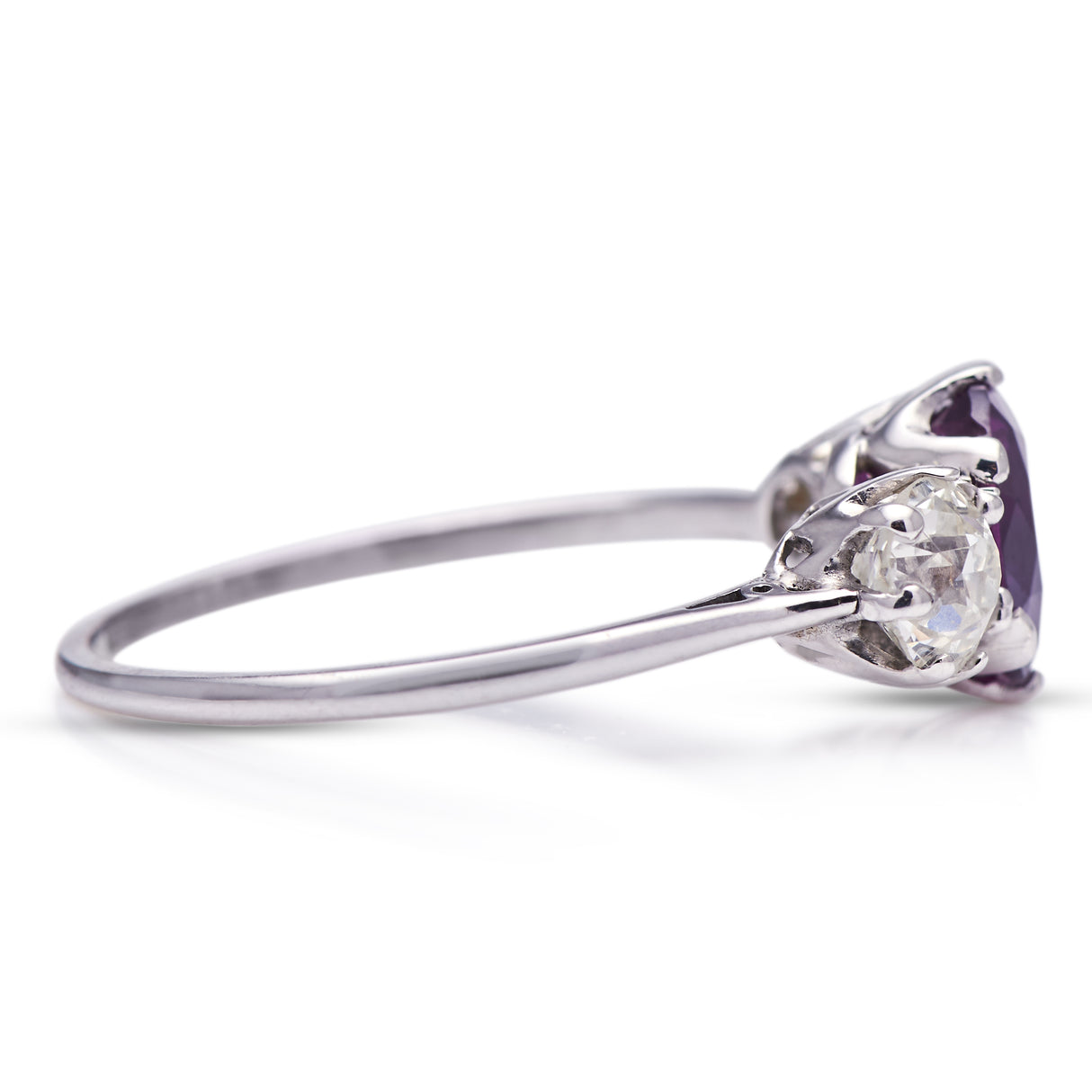 Art Deco, purple sapphire and diamond three-stone engagement ring, platinum