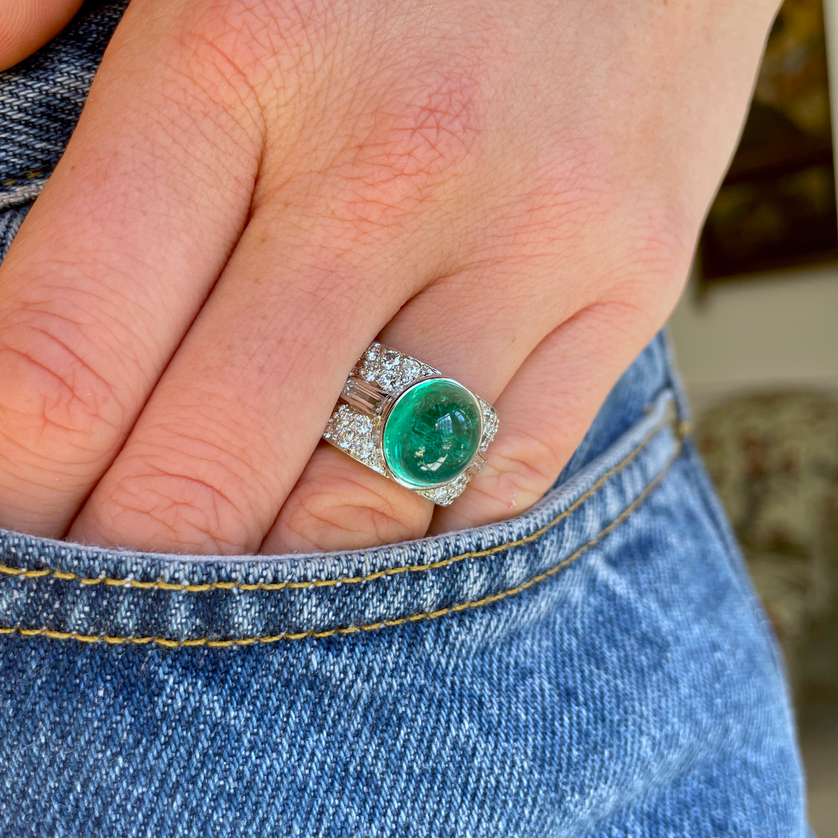 Trabert Hoeffer Mauboussin Art Deco emerald and diamond ring, worn on hand.
