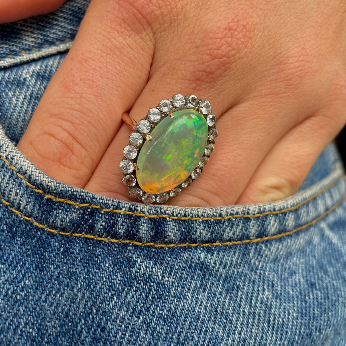 A rare natural cabochon crystal opal & paste cluster ring, circa 1900