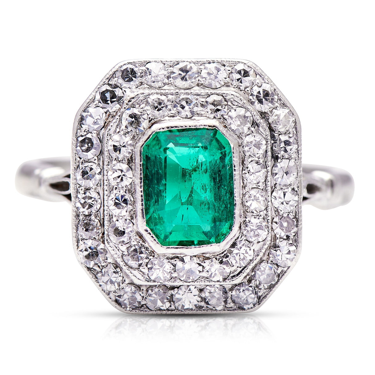 Vintage emerald and diamond cluster ring, front view.