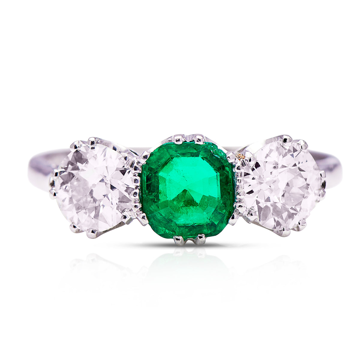 three stone, platinum, diamond and emerald ring