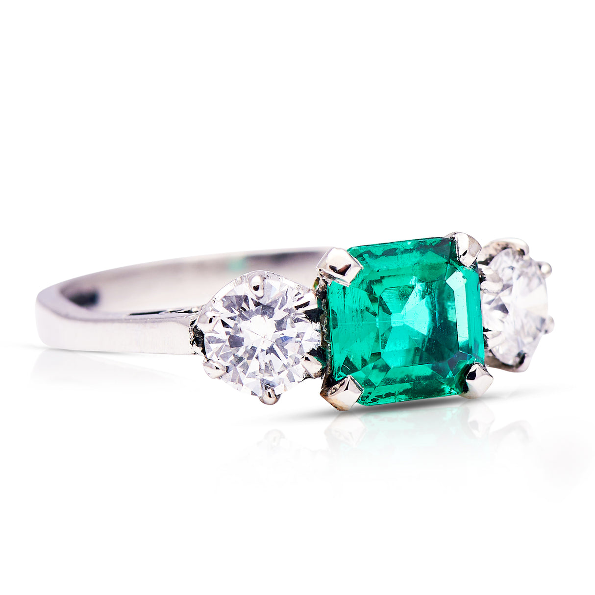 Colombian emerald | Art Deco, platinum, emerald and diamond three stone ring
