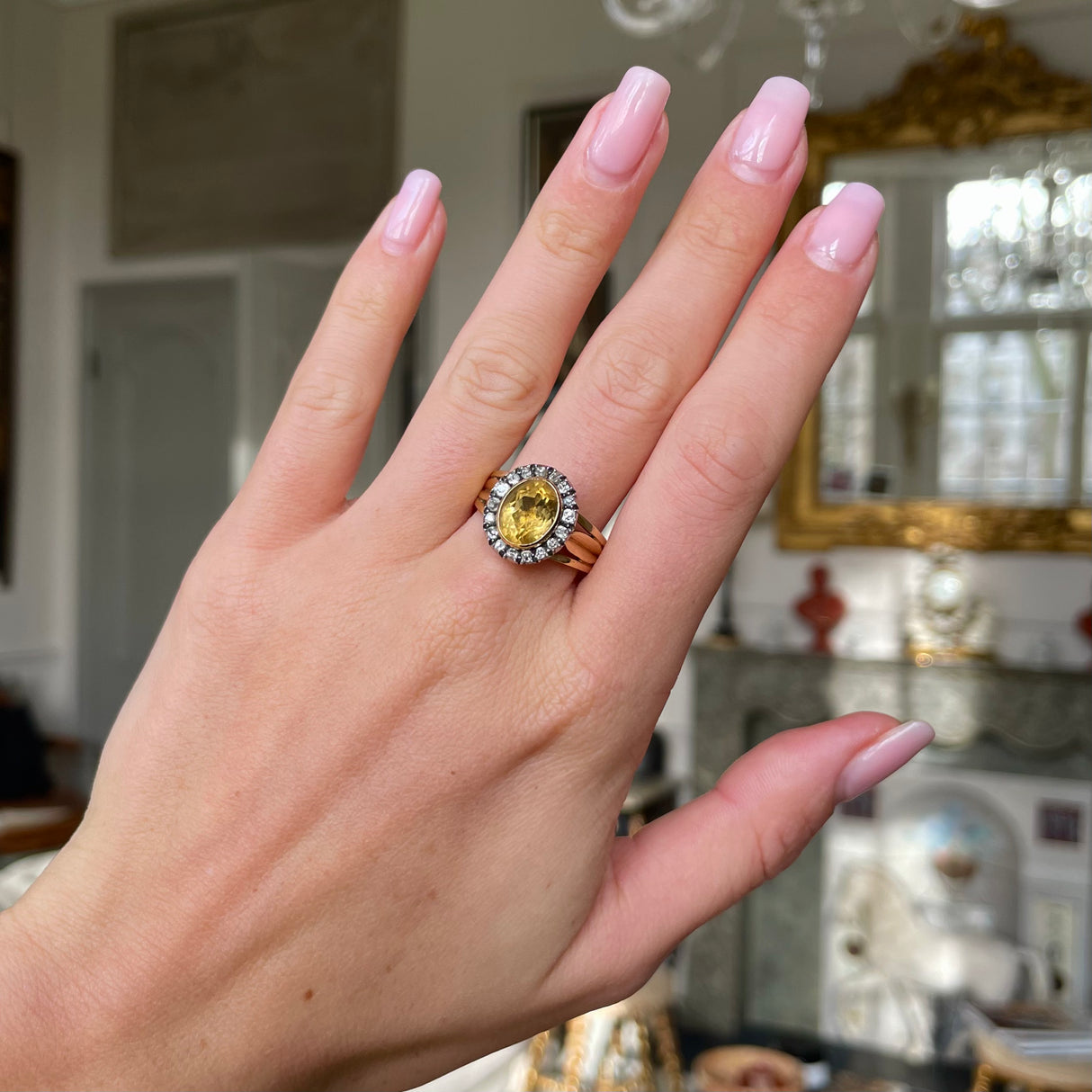 Antique Georgian citrine and diamond cluster ring, worn on hand.