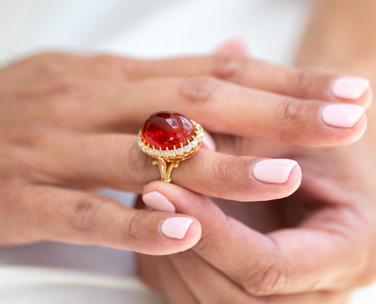 Edwardian, 18ct yellow gold, cabochon fire opal and diamond cluster ring