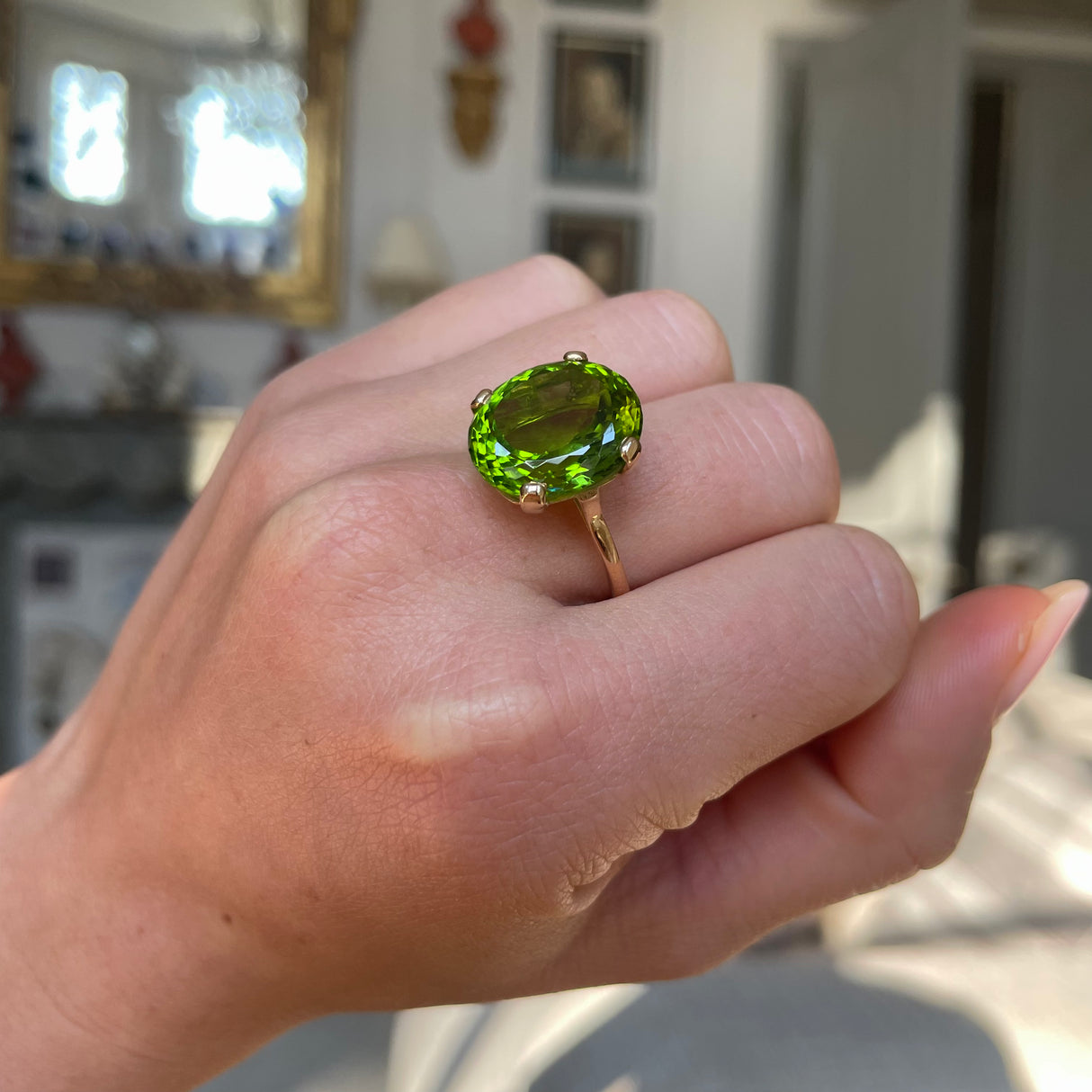 French | a large oval 12ct peridot ring, 18ct gold