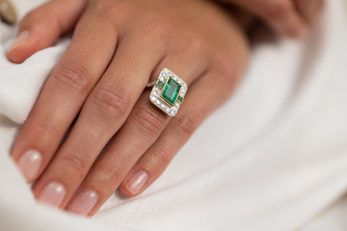 Mid century, 18ct gold, emerald and diamond cluster ring