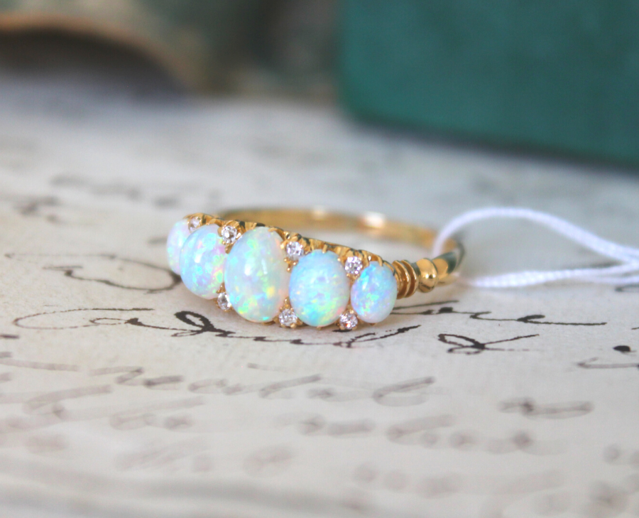 Edwardian, 18ct gold, opal and diamond five-stone ring