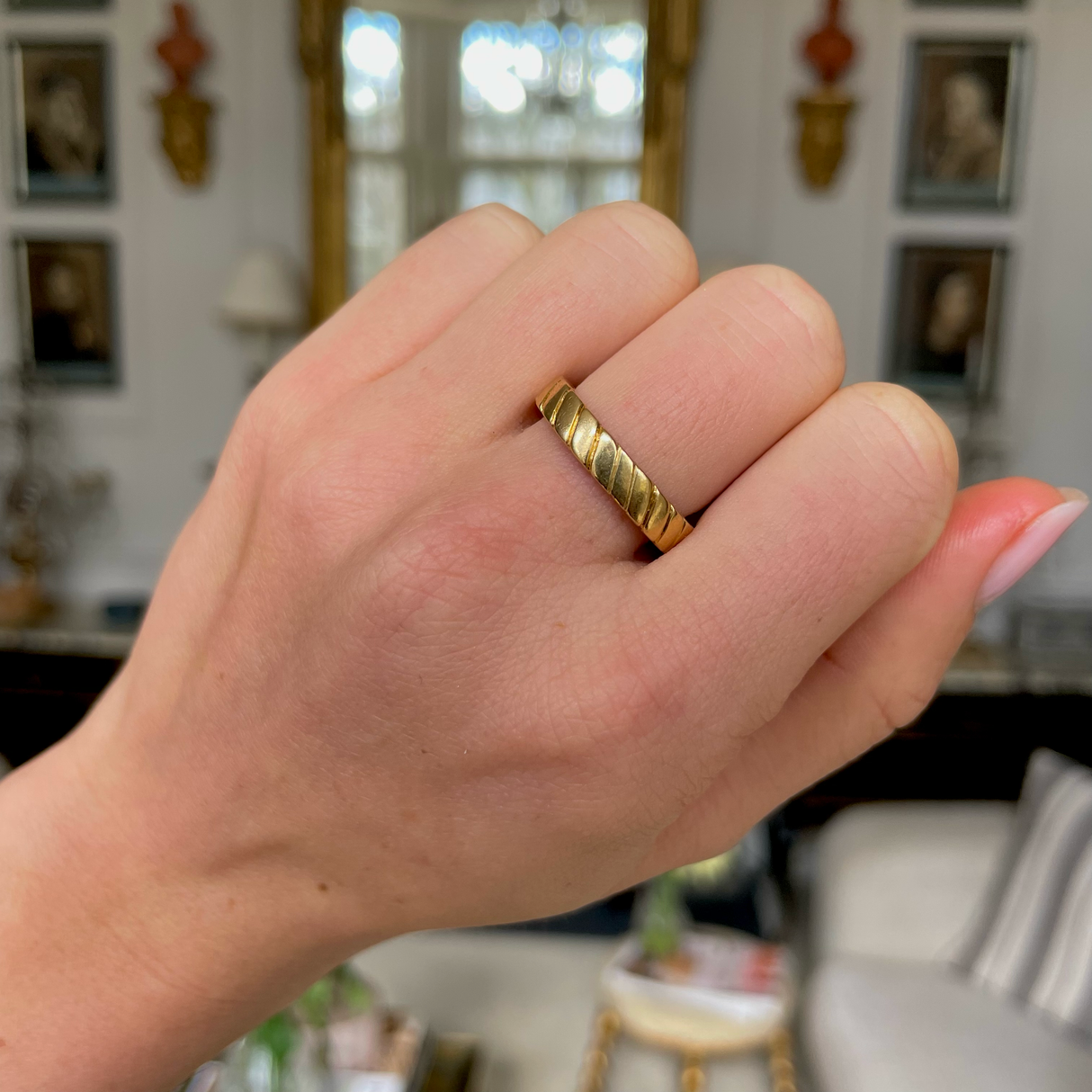 Van Cleef & Arpels 18ct yellow gold band, worn on hand.