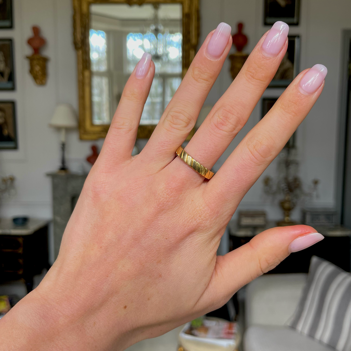 Van Cleef & Arpels 18ct yellow gold band, worn on hand.