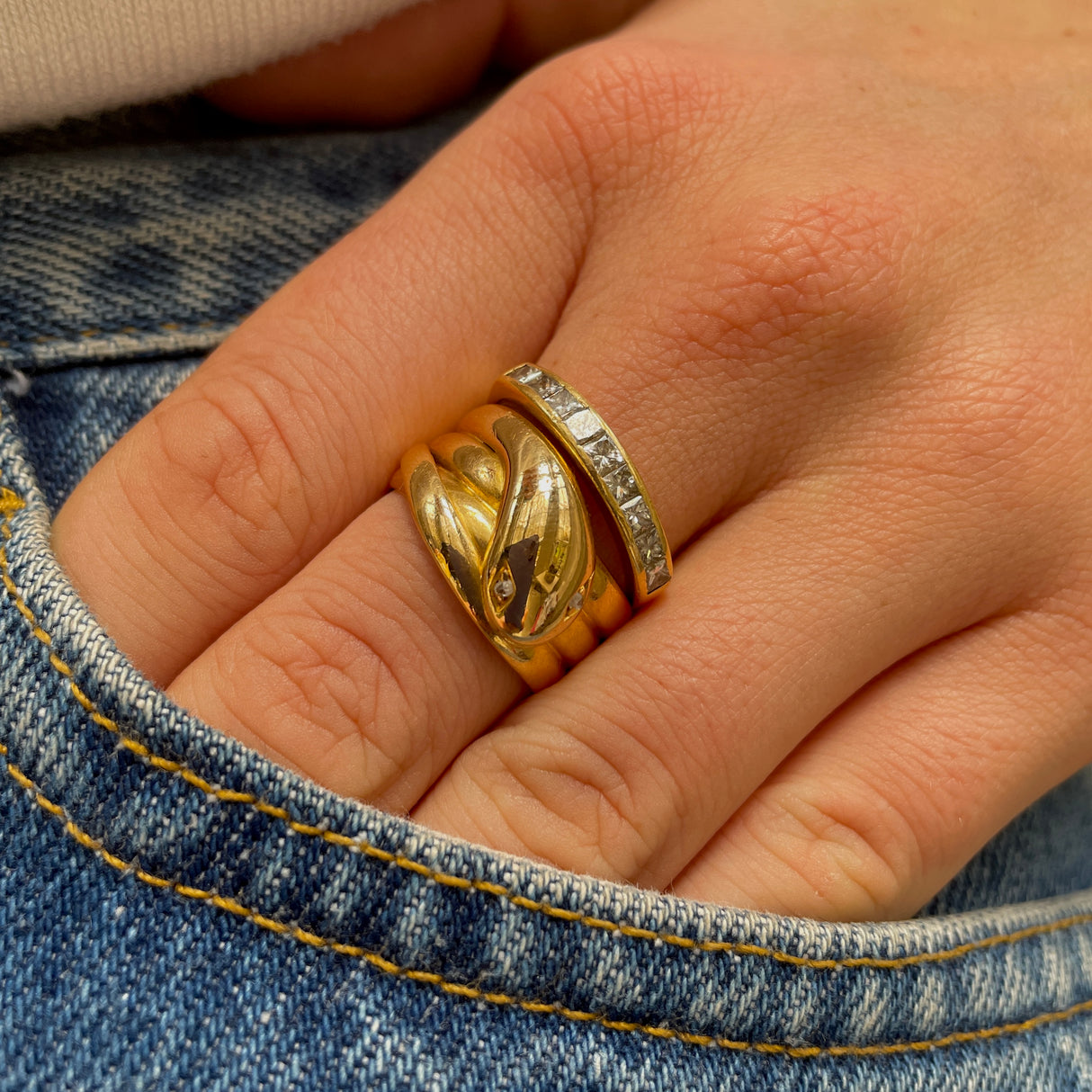 Victorian diamond set snake ring, worn on hand.