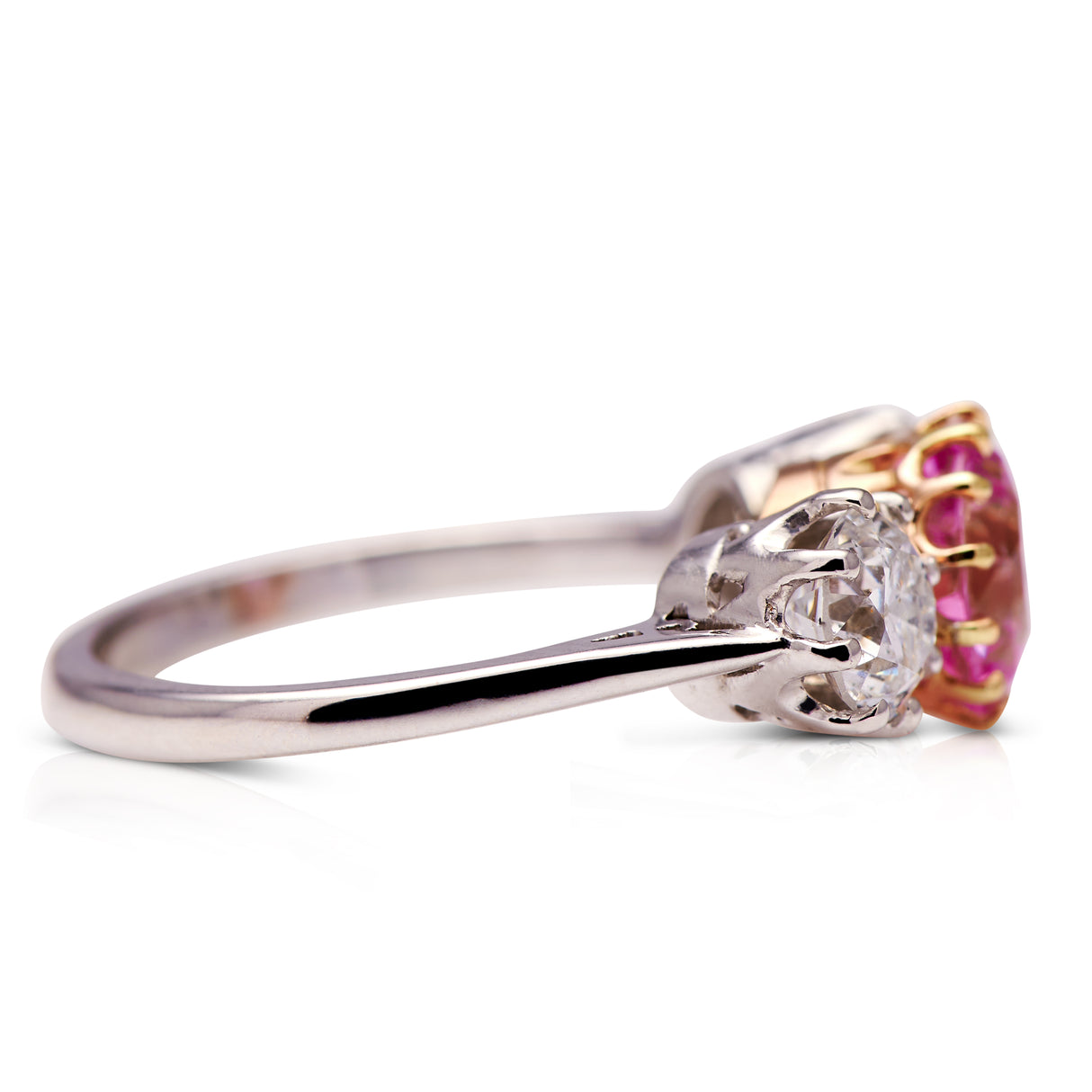 Vintage topaz and diamond three stone ring, side view.