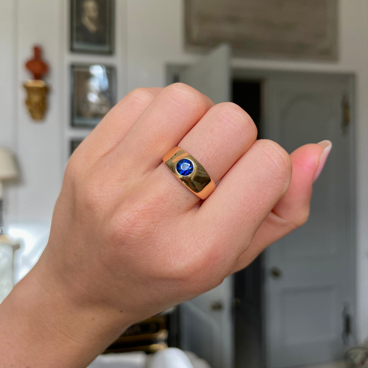 Victorian Burmese sapphire engagement ring, worn on hand.
