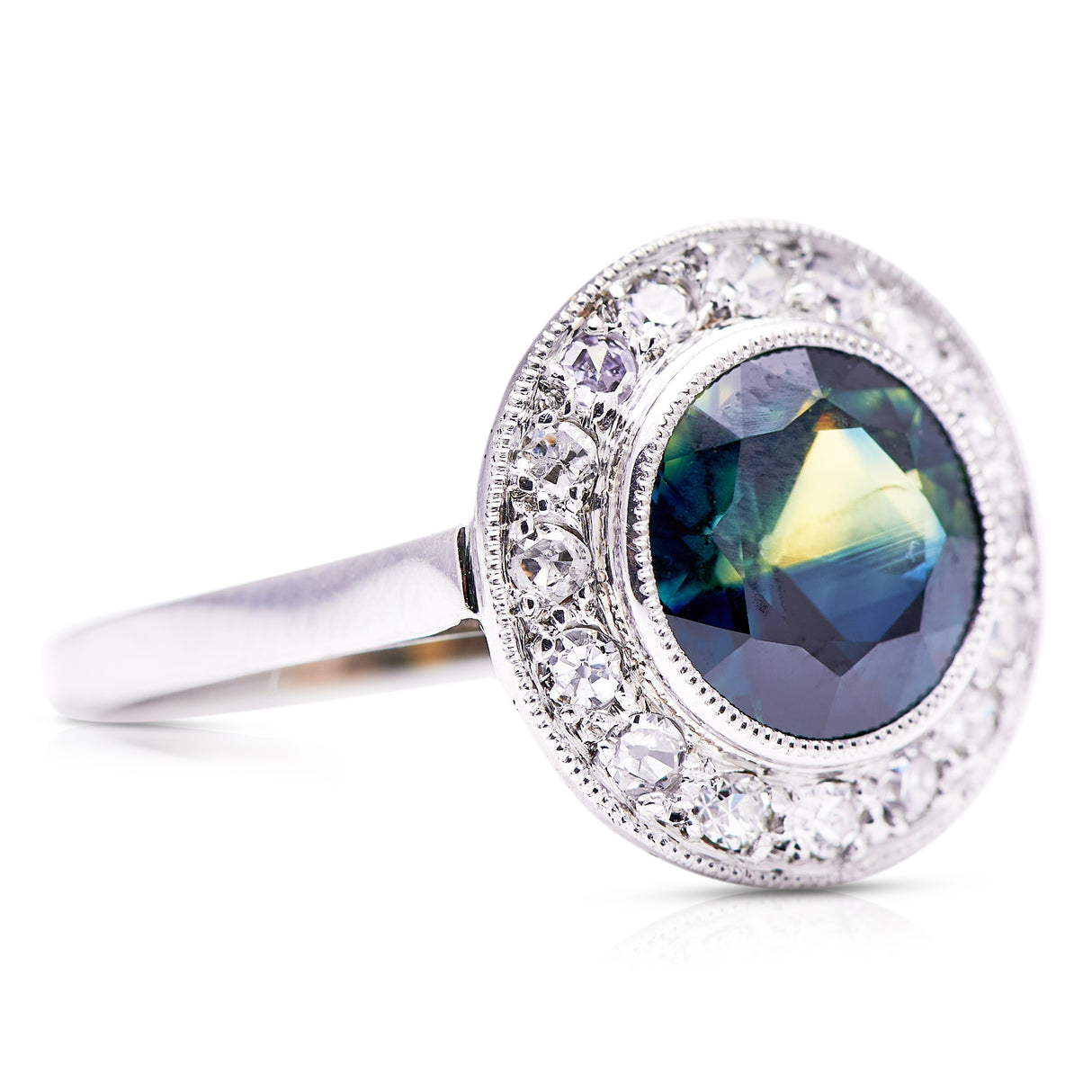 green yellow sapphire and diamond cluster ring, side view.