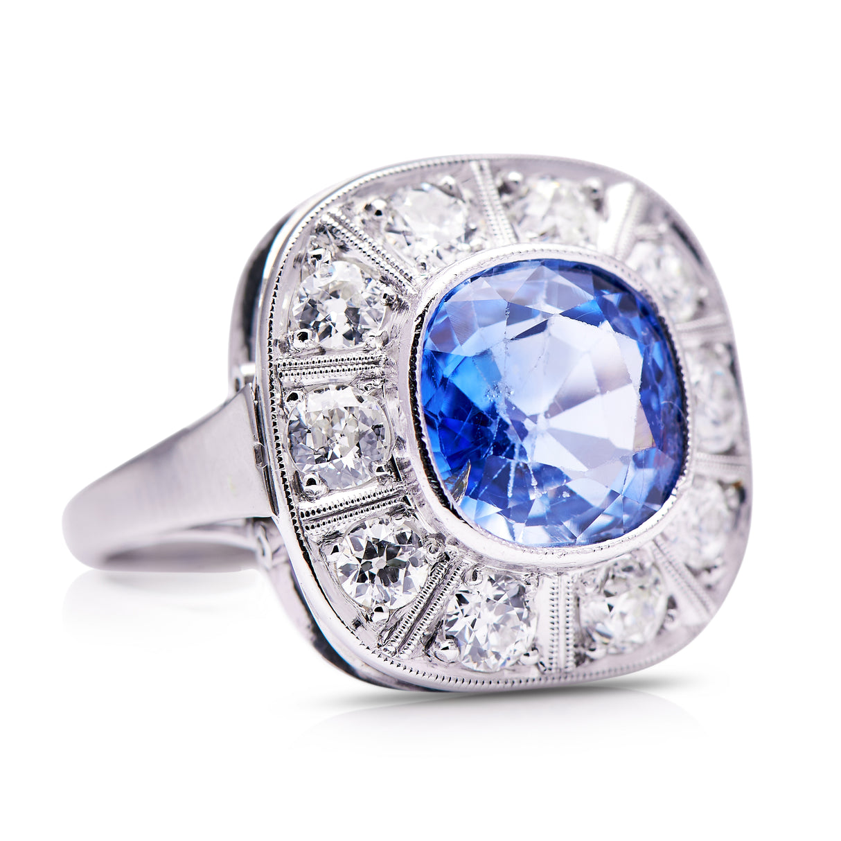 Art Deco, ceylon cushion-cut sapphire and diamond cluster ring, side view.