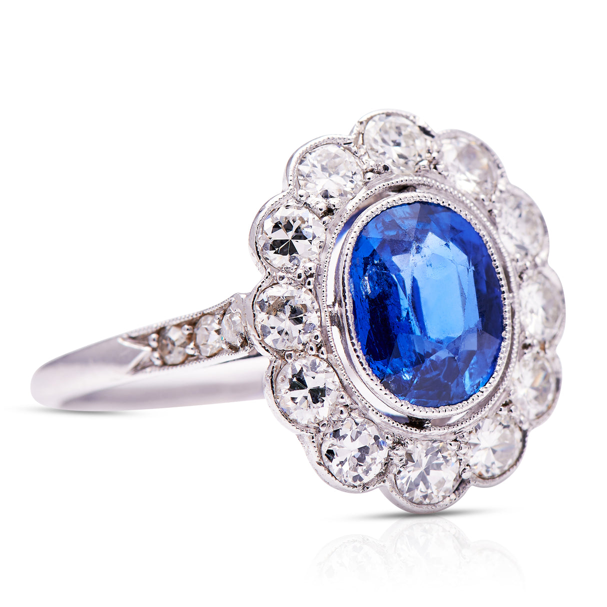 Edwardian_Platinum | Sapphire_Diamond Cluster Ring | Antique_Engagement_Rings | Sapphire_rings | Sapphire_ring | Sapphire_and_diamond rings | Sapphire_engagement_ring | Sapphire_engagement_rings | Sapphire and diamond engagement ring. Sapphire and diamond engagement rings. Platinum sapphire ring. Antique sapphire ring. Antique sapphire rings.