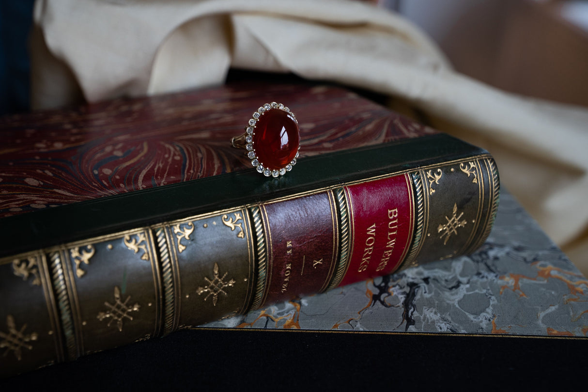 Edwardian, 18ct yellow gold, cabochon fire opal and diamond cluster ring