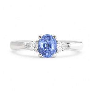 An antique-inspired light blue sapphire & diamond three-stone engagement ring in platinum.