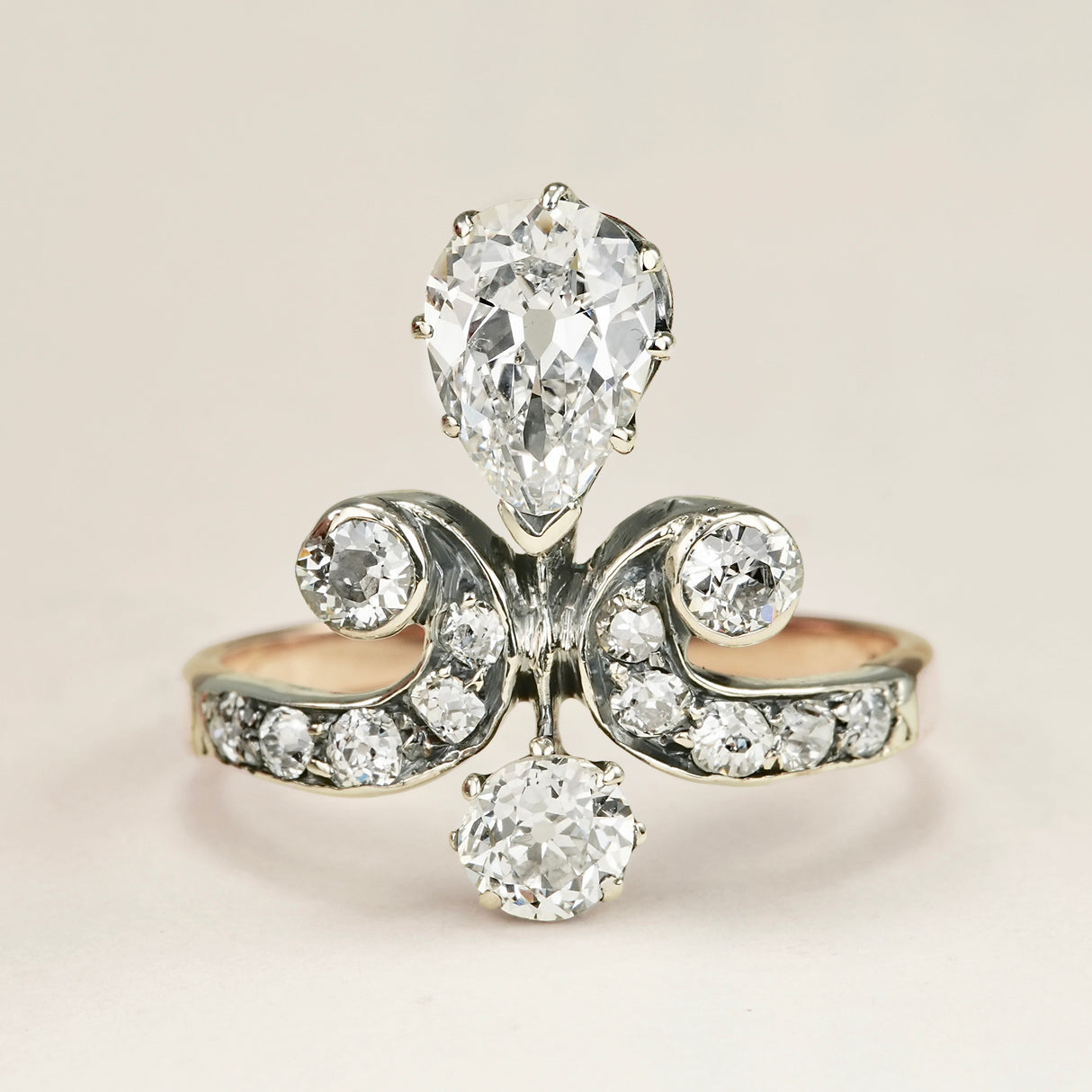 Antique, Edwardian pear cut diamond motif engagement ring