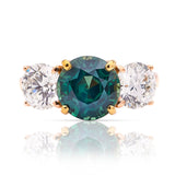 Vintage, teal sapphire and diamond three-stone engagement ring