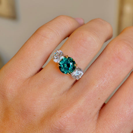 Vintage, teal sapphire and diamond three-stone engagement ring