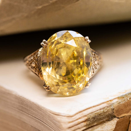 A vintage 1950s 19ct sunshine-yellow sapphire cocktail yellow gold ring.