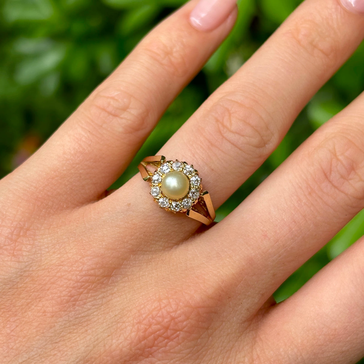 Vintage, 1980s pearl & diamond cluster ring worn on hand.