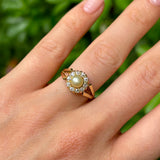 Vintage, 1980s pearl & diamond cluster ring worn on hand.